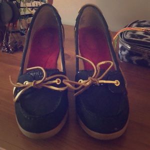Woman’s black Sperry